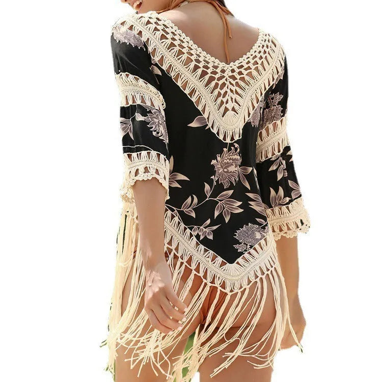 Women's apricot sun protection blouse with V-neck and hollow-out sleeves on a hanger.