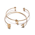Gold vintage cuff bracelet with knotted arrow design for women