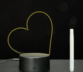 Black 3D acrylic message board night light with remote control and stylus on desk