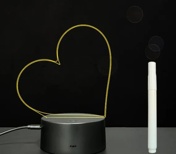 Black 3D acrylic message board night light with remote control and stylus on desk