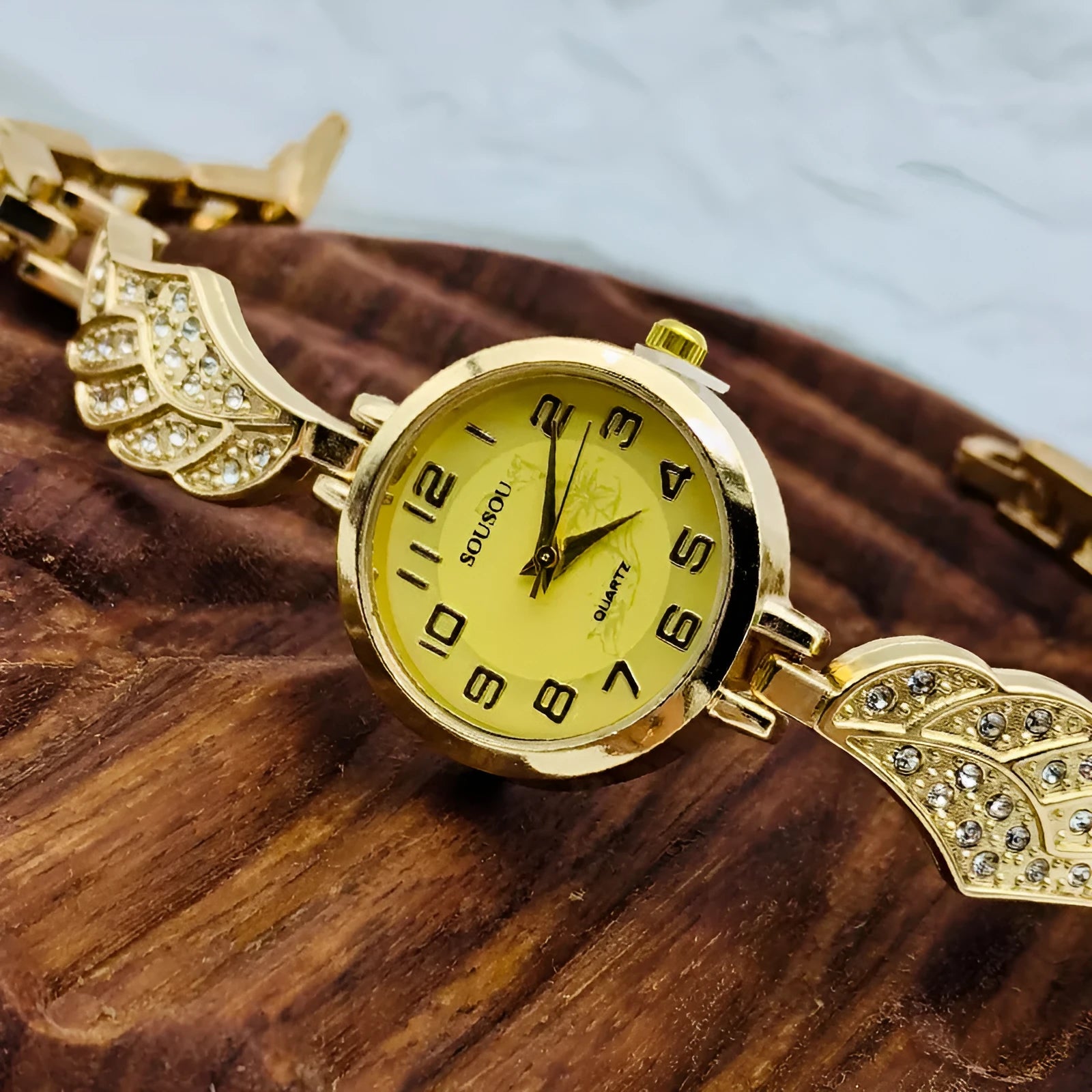 Women's stainless steel watch with round dial in gold, gold white, or black golden surface options