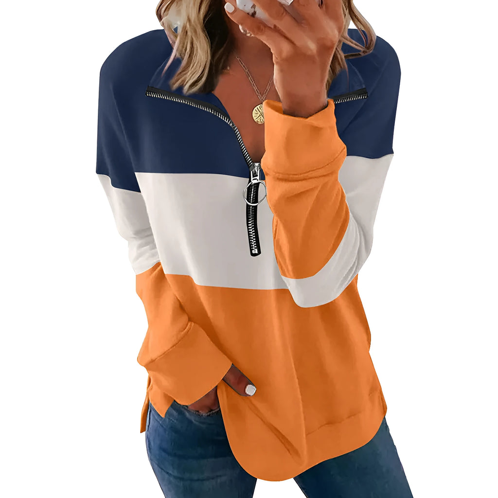 Women's loose long-sleeved leopard print polyester sweater on a hanger, showing orange and black/grey print variants.