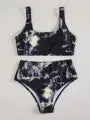 Women's marble print high-waist bikini set in blue tie-dye pattern for swimming.