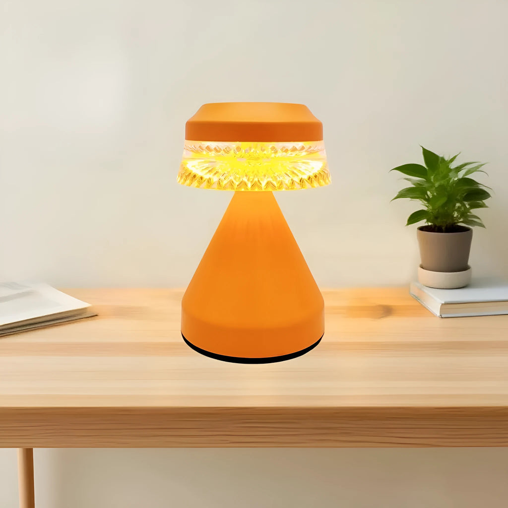 Black USB-charging LED night lamp with three-colour dimming on a wooden bedside table.