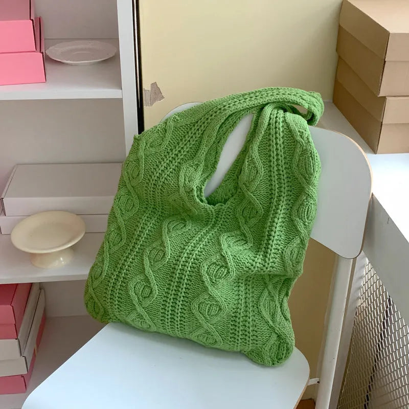 Retro hollow knitted polyester shoulder bag measuring 55cm by 37cm in solid colour with double straps