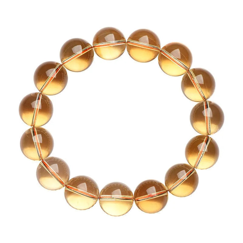 Original design natural citrine scattered beads ball bracelet showing polished yellow stones.