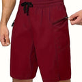 Men's quick-drying polyester beach shorts in straight-leg design with solid colour options