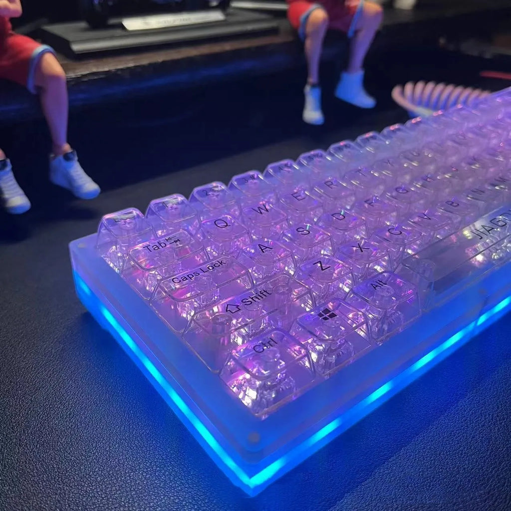 132 transparent plastic key caps arranged for a full-size keyboard layout