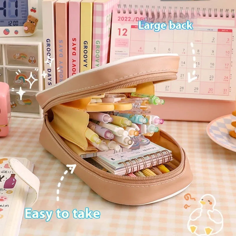 Transparent PVC pencil case with cartoon design showing large capacity interior and zipper closure