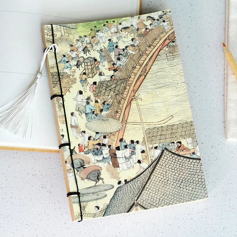 Antique wire-bound notebook with embossed cowhide cover and black wax rope binding