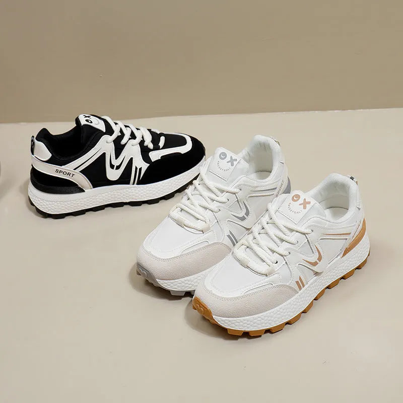 Women's black platform casual trainers with round toe and lace-up front on a white background.