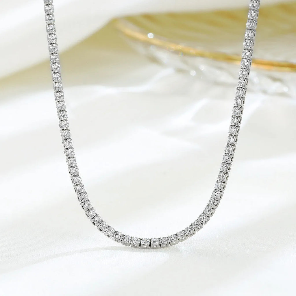 Women's sterling silver necklace with round diamond-cut pendant on silver chain