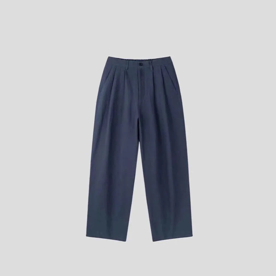 Men's apricot-coloured loose-fit cotton linen trousers with a wide-leg cut and elastic waistband