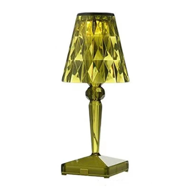 Rose gold plated portable touch control night light on a surface, showing its cubic base and height.