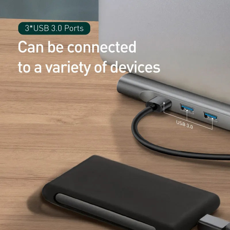 Grey aluminium USB-C docking station with cooling bracket showing multiple ports including HDMI and network