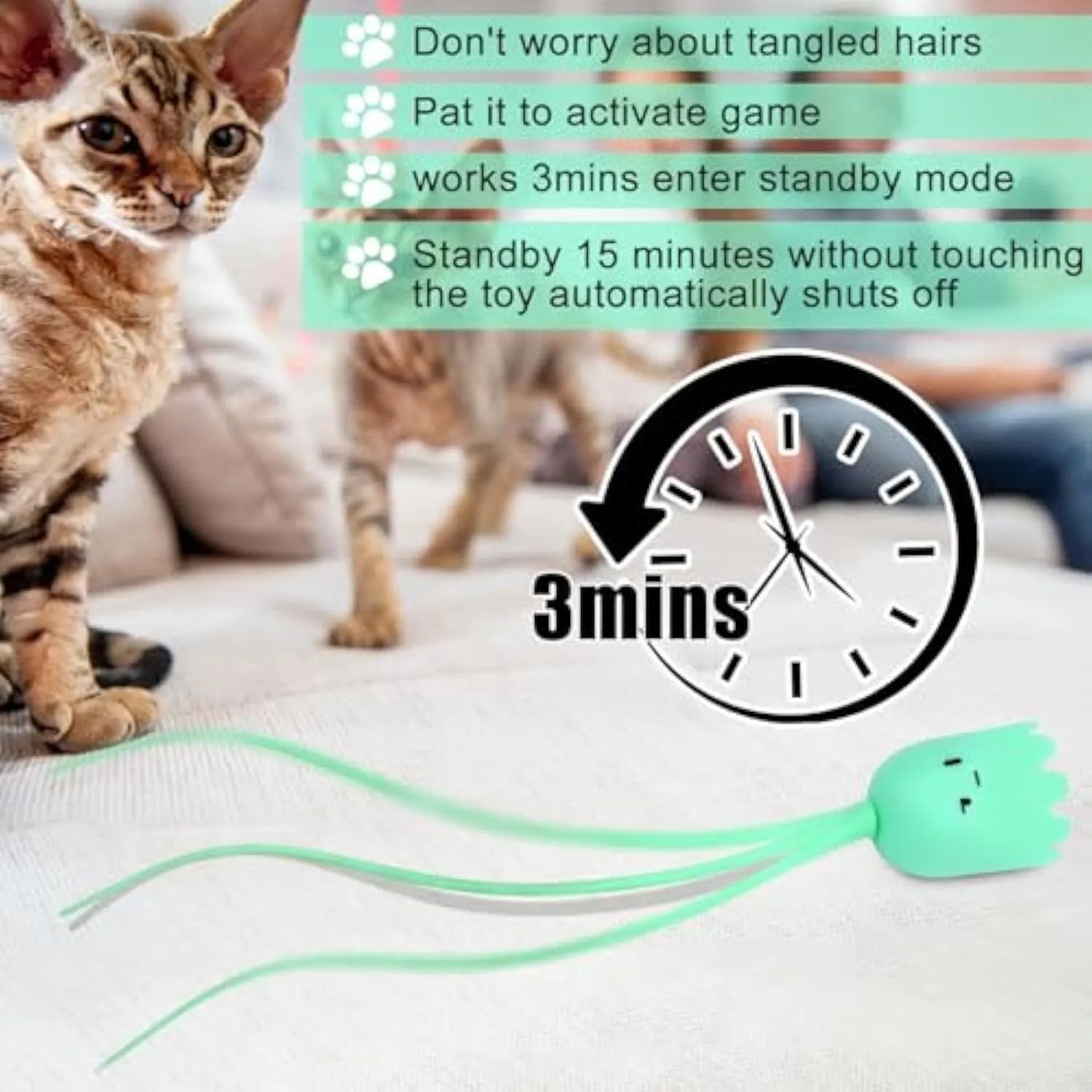 Green automatic cat wand toy with swinging silicone tail on floor for indoor cat play