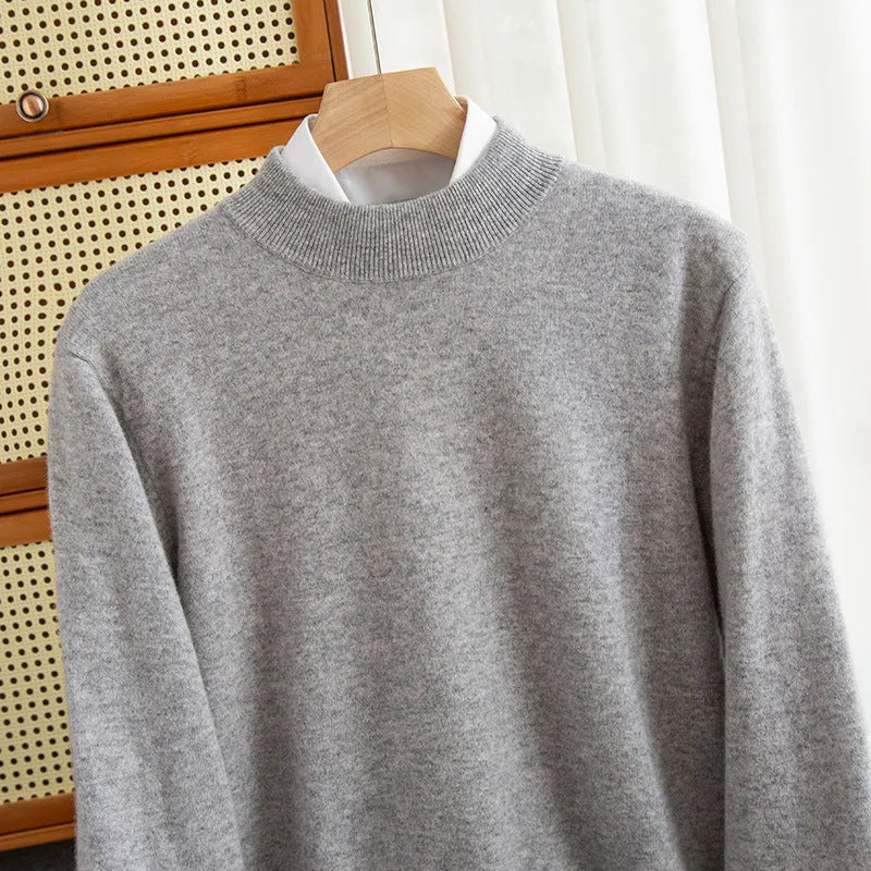 Men's loose fit half-collar wool sweater in a neutral colour on a hanger