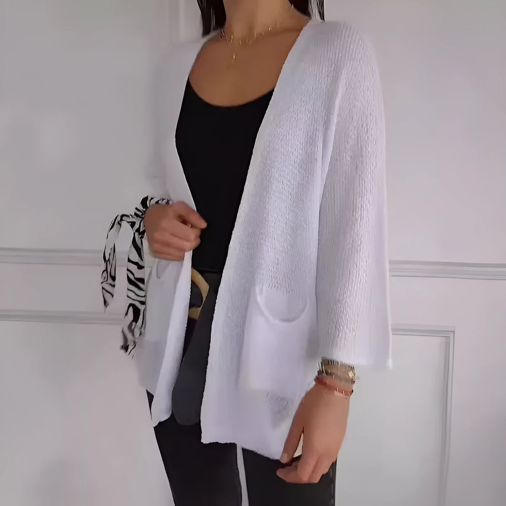 Women's waffle knit cardigan coat with nine-quarter sleeves in army green colour showing pocket detail