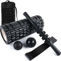 Black foam roller massage stick with gear design, 33cm long, on a plain background.