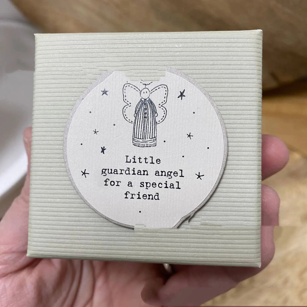 Boxed guardian angel resin ornament in a modern cartoon style.