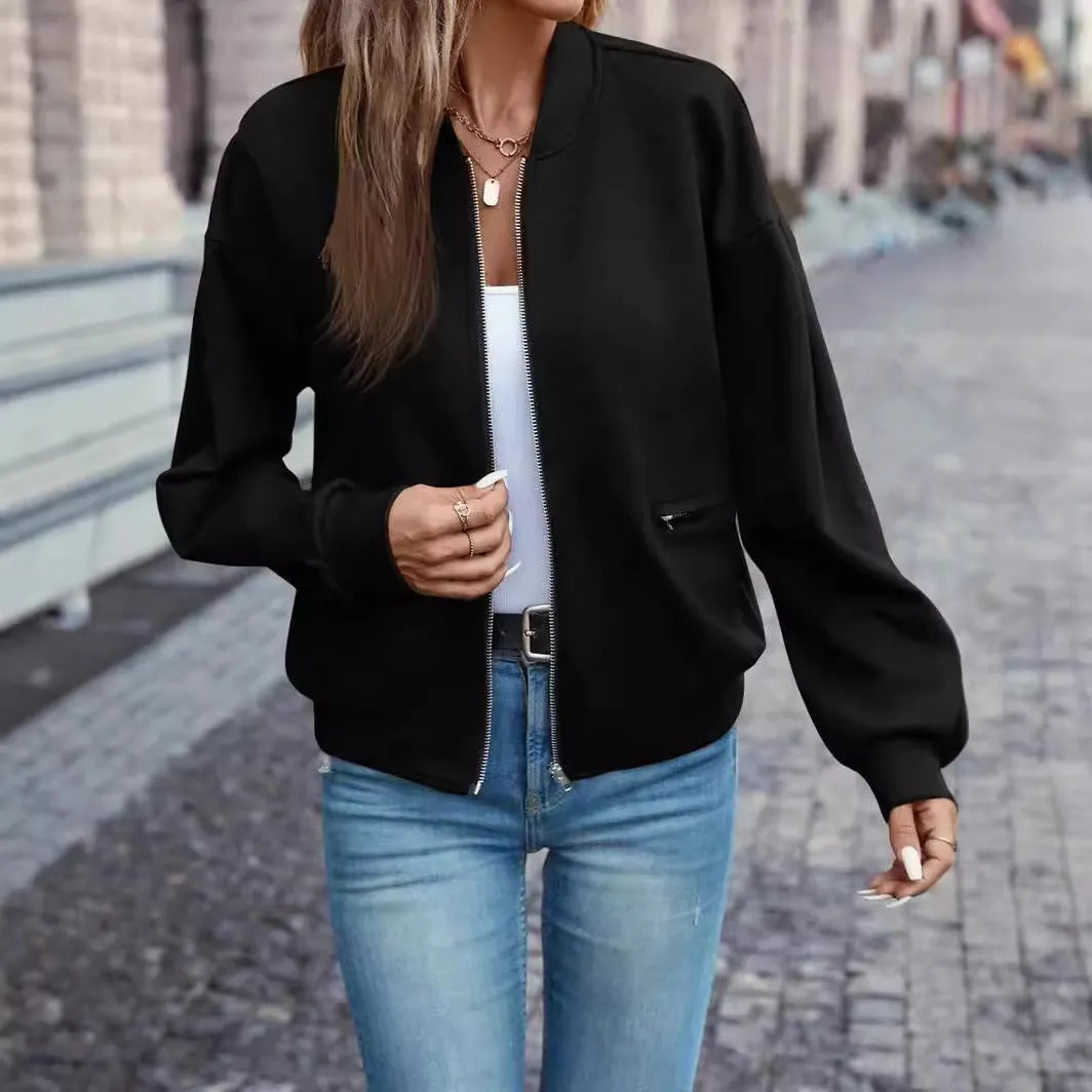 Black women's casual zip jacket with long sleeves and faux pockets on a model.