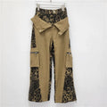 Women's dark khaki leopard print high waist jeans with straight leg cut and tooling style details
