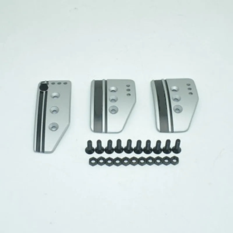 Aluminium alloy manual transmission car pedal set in grey or black with brake, accelerator, and clutch pedals.