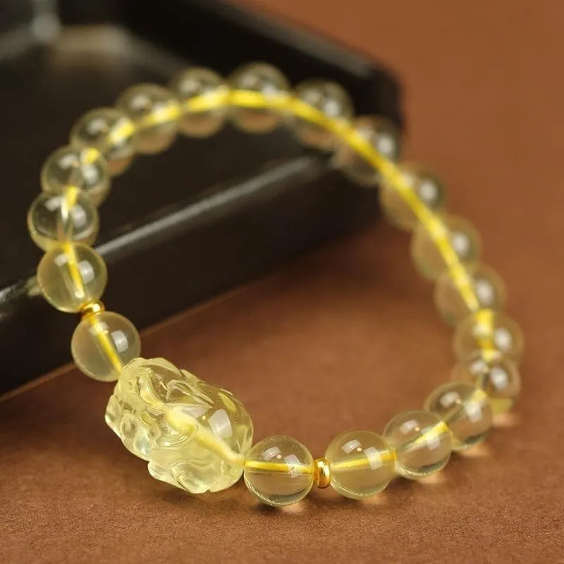 Yellow leather bracelet with artificial citrine crystal beads in Chinese Pi Xiu design