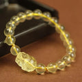 Yellow leather bracelet with artificial citrine crystal beads in Chinese Pi Xiu design