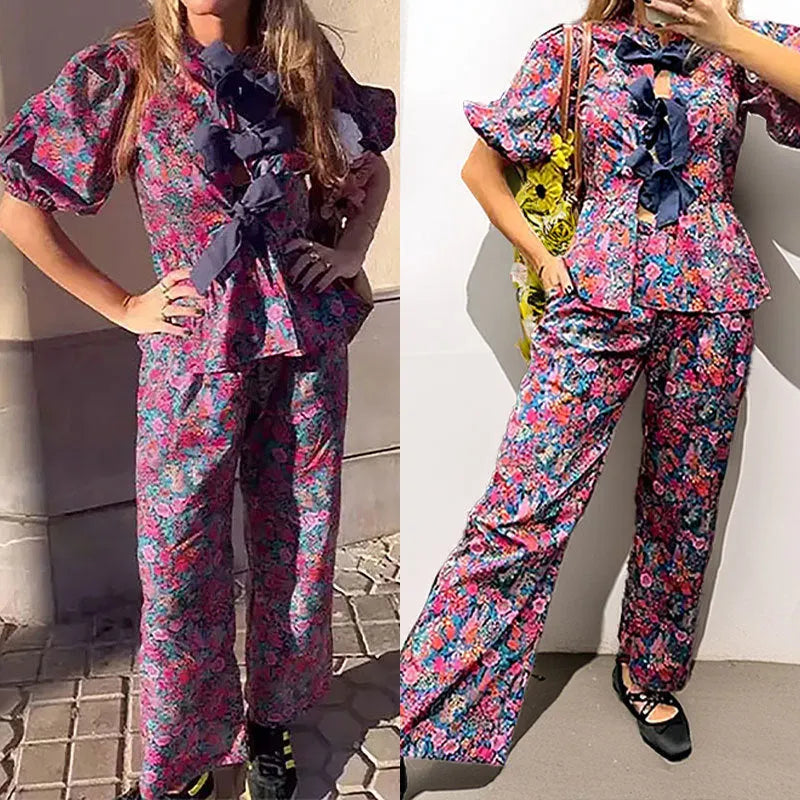 Floral printed tie-neck blouse and trousers suit set with puff sleeves.