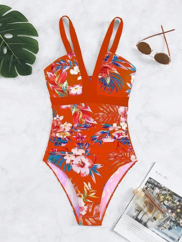 Women's floral print backless one-piece swimsuit on a hanger