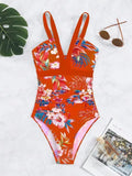 Women's floral print backless one-piece swimsuit on a hanger