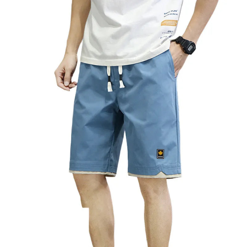 Loose straight-leg polyester beach shorts with elastic waist in multiple colour options