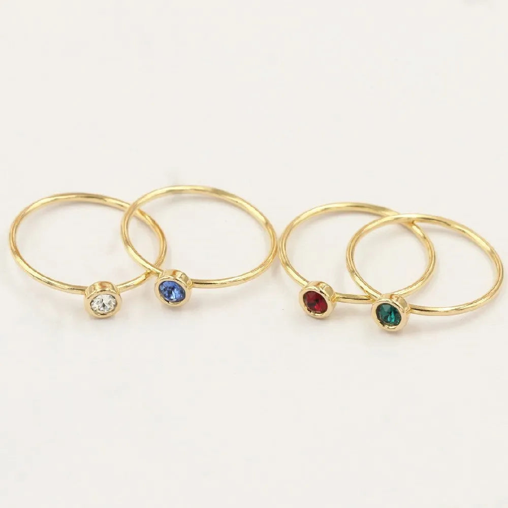 Women's 14K gilded copper zircon ring in green, blue, dark red, and white colour options.