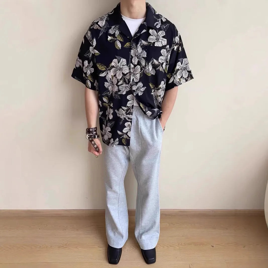 Black men's vintage Cuban collar shirt with floral print, made from thin ice silk fabric for summer.