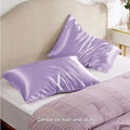 A pair of solid-colour polyester satin pillowcases in a selected shade, shown folded.