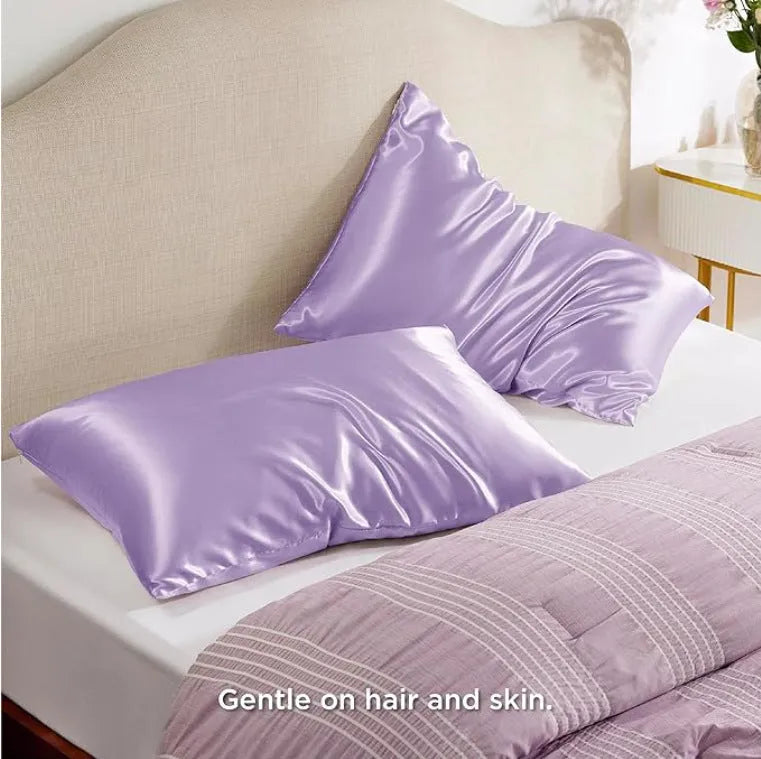 A pair of solid-colour polyester satin pillowcases in a selected shade, shown folded.