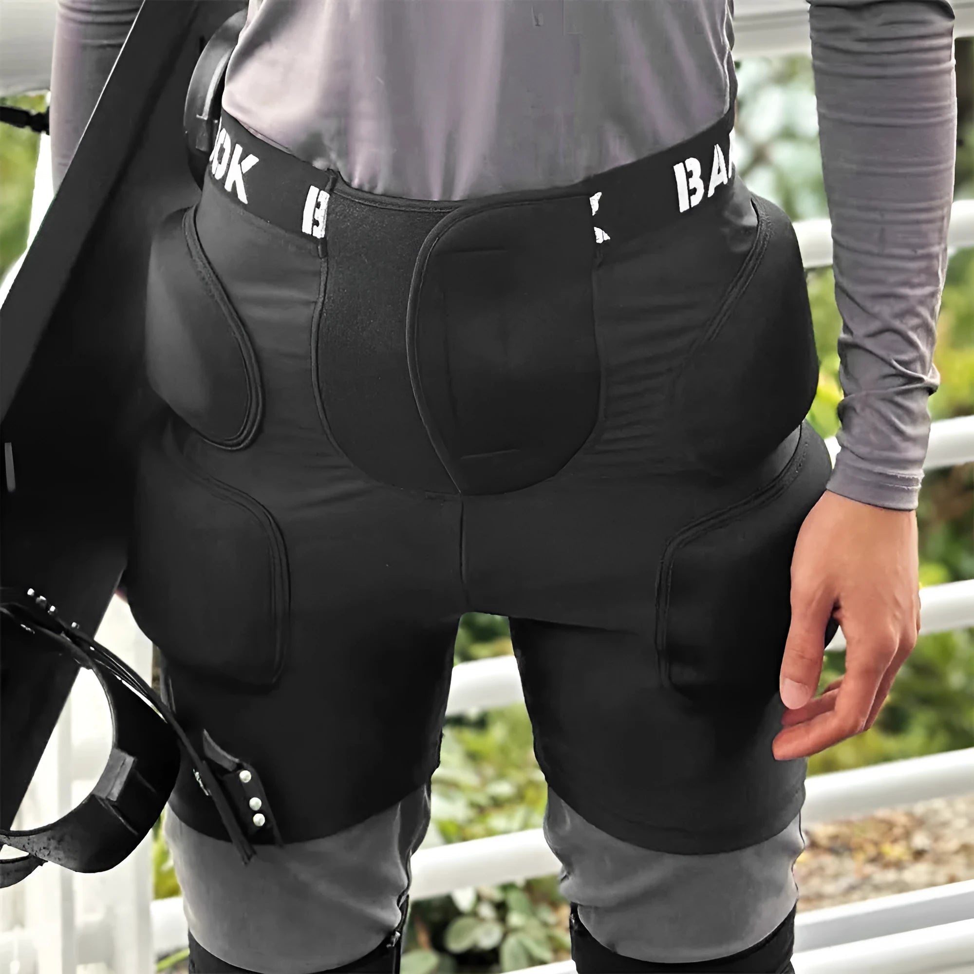 Black adult hip protection pants with NBR foam padding for roller skating and skateboarding