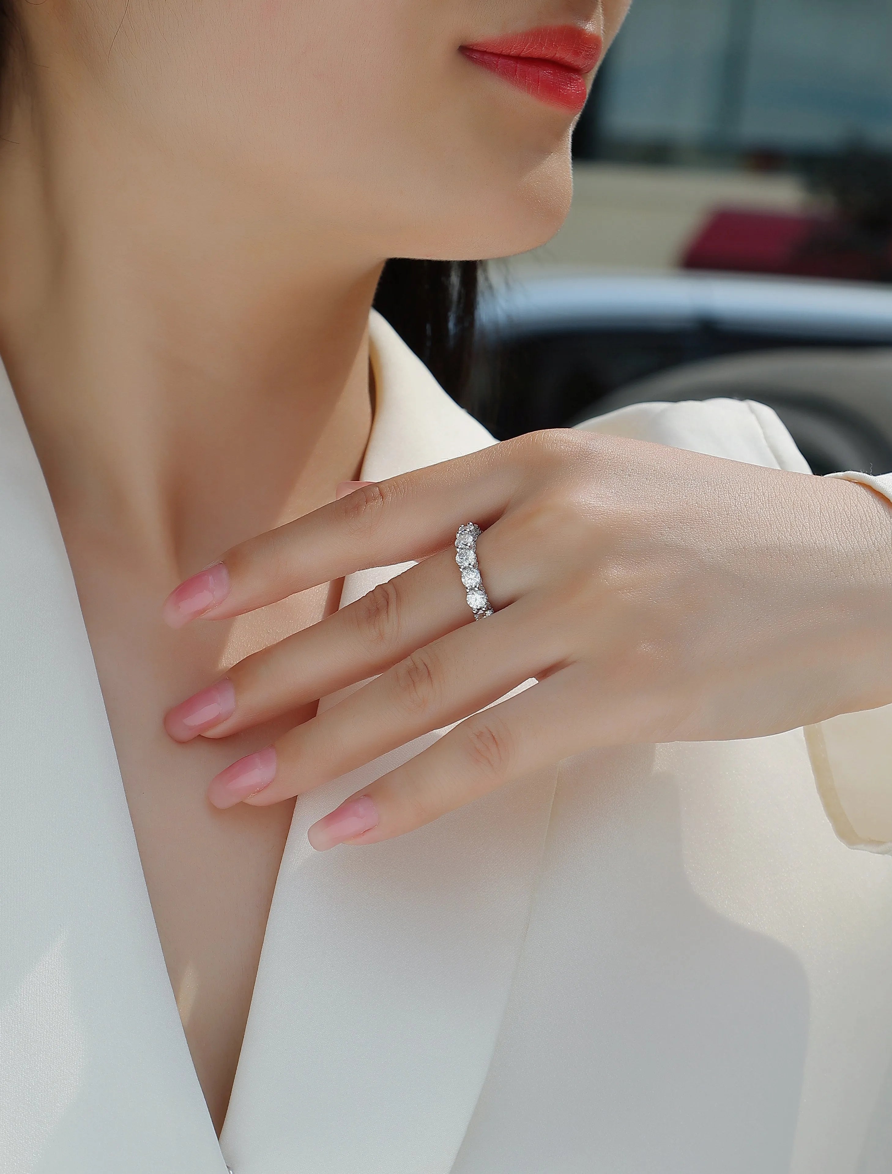 Ferris Wheel moissanite ring set in S925 silver with platinum plating on a white background