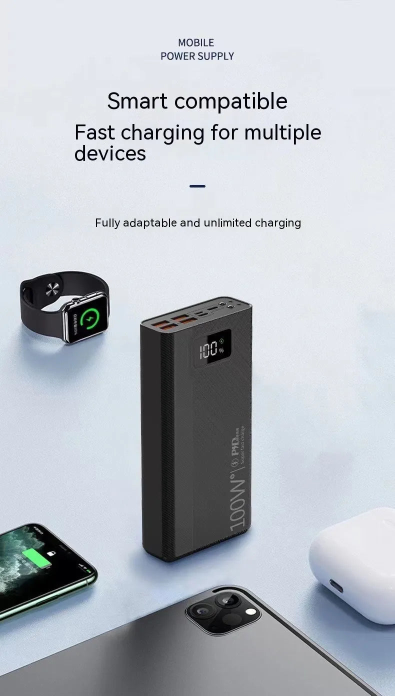 Black and white large capacity power bank with fast charging support, showing size scale.