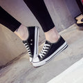 Women's solid colour canvas casual flat shoes showing available colour options and size range