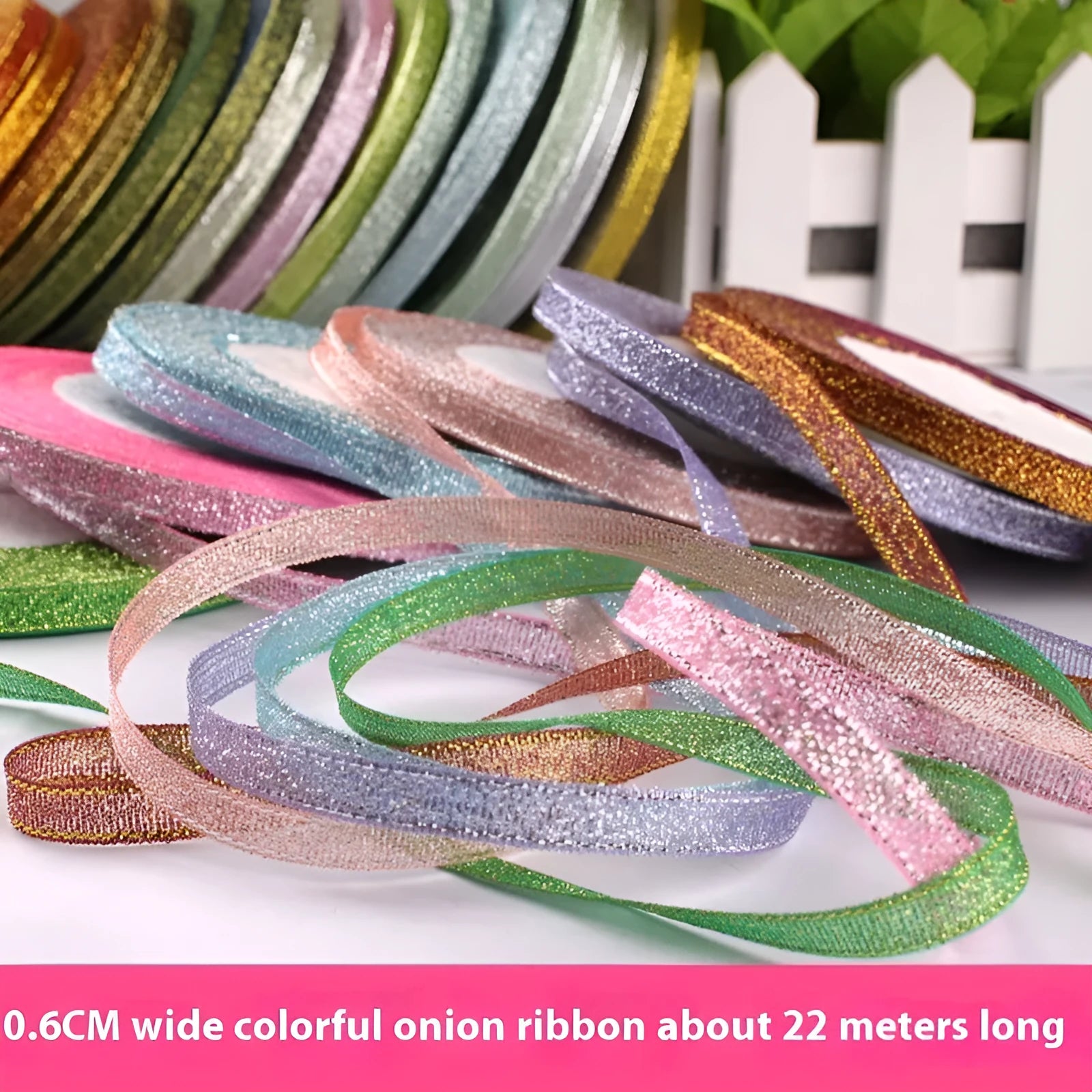 Roll of 0.6cm wide coloured polyester ribbon in onion-dye shades for clothing and gift packaging