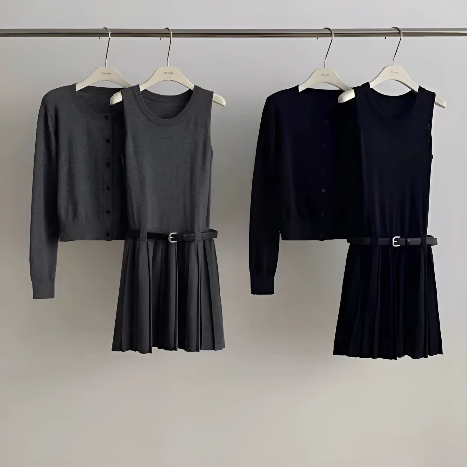 Women's grey Art retro style two-piece set with long-sleeved cardigan and pleated vest skirt featuring a belt