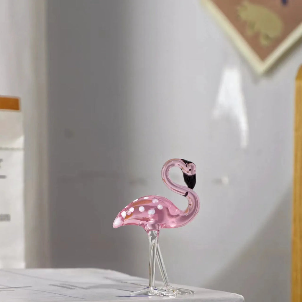 Pink crystal flamingo decorative animal figure on table with modern minimalist style