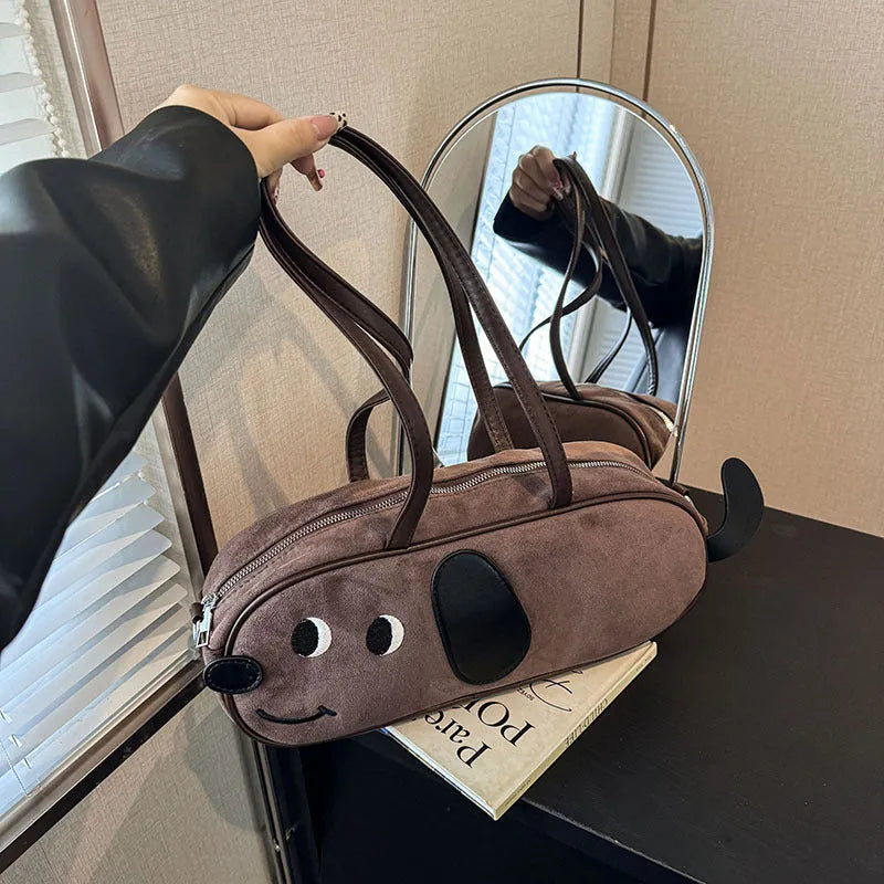 Sausage dog crossbody bag in coffee brown matte finish with single shoulder strap and horizontal shape