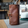 Handmade vintage cow leather wallet in black or dark brown with tape closure.