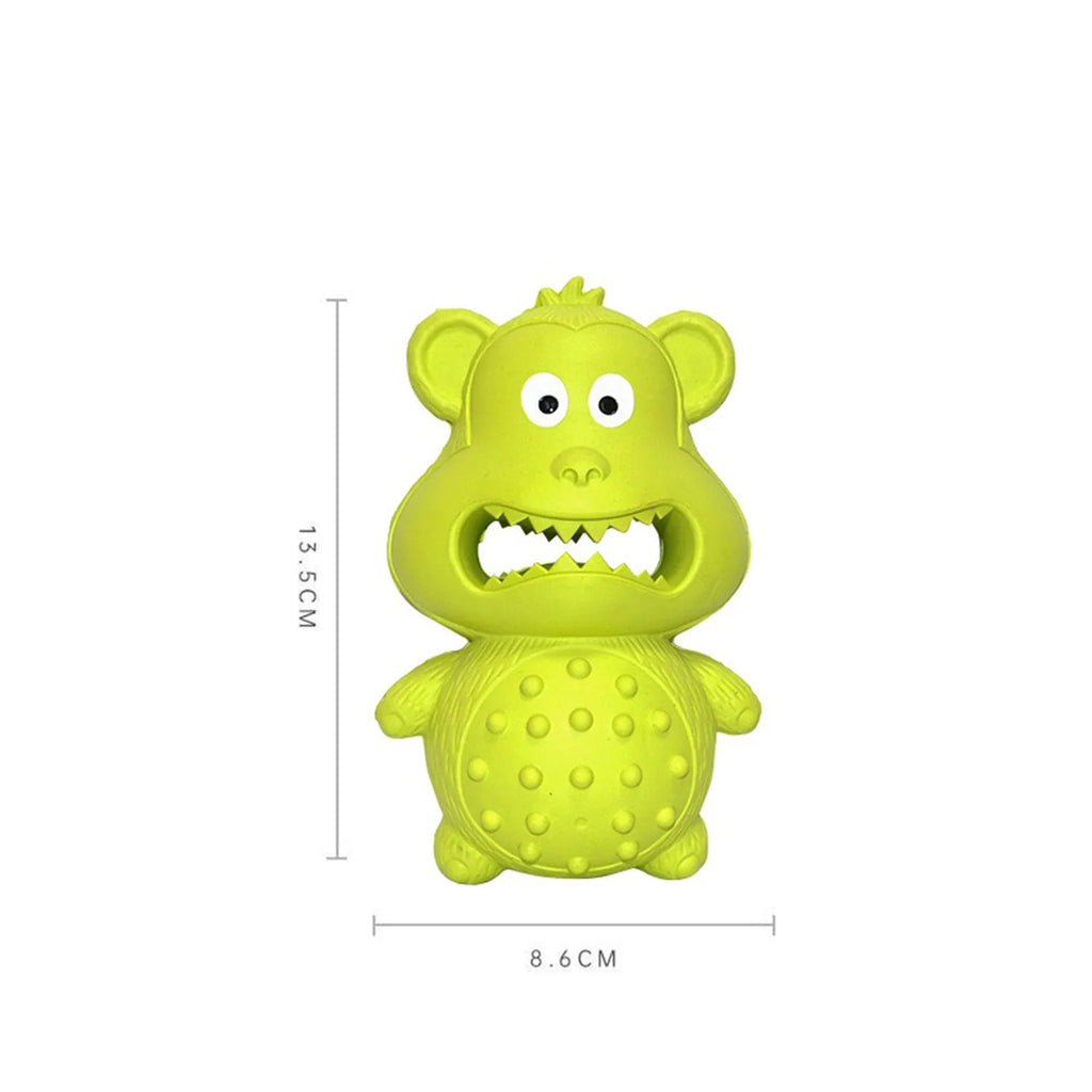 Green and yellow natural rubber chew toy for large breed aggressive dogs on a wooden floor.