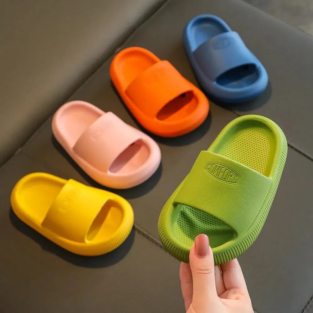 Children's EVA slippers in mixed colours with non-slip soles showing size range 24-35