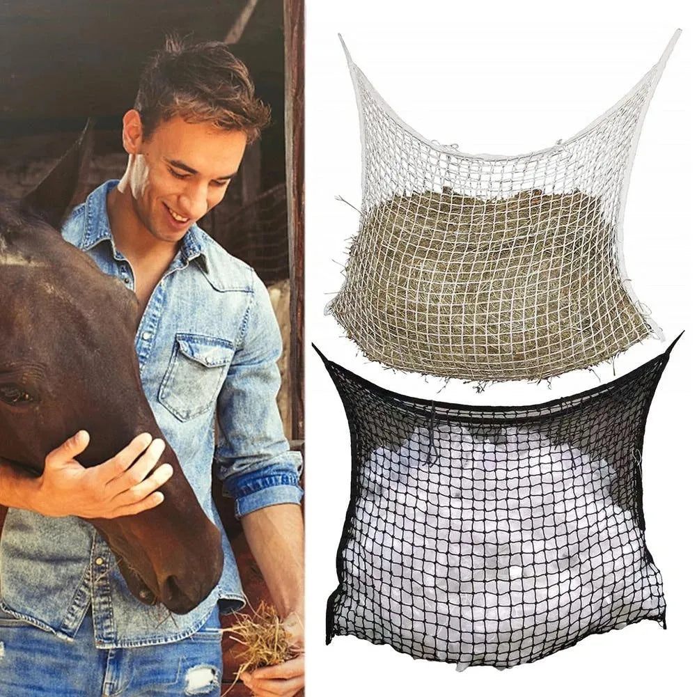 Black woven PE rope mesh feeding bag for horses hanging on a fence