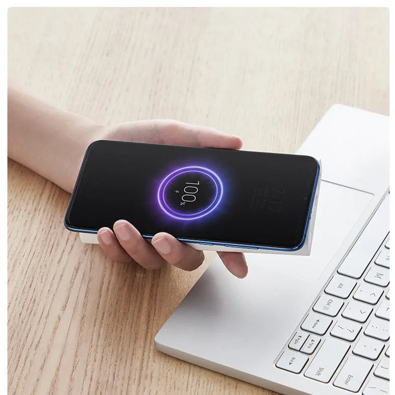 Black or white plastic 10000mAh power bank with wireless charging and USB Type-C port.